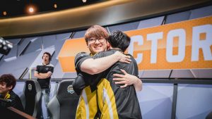 Picture of Team Dignitas's Johnny "Altec" Ru hugs teammate Adrian "Adrian" Ma